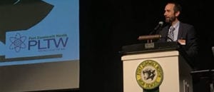 Photo: Pat Brown speaking at podium at a science educators conference